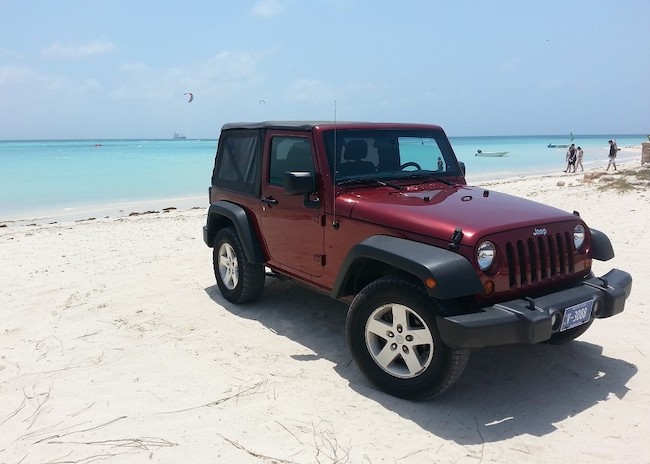 Red jeep on the coast of Cozumel.