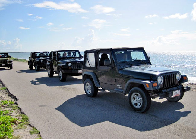 Benjamin with his family about to have a wonderful Jeep excursion.