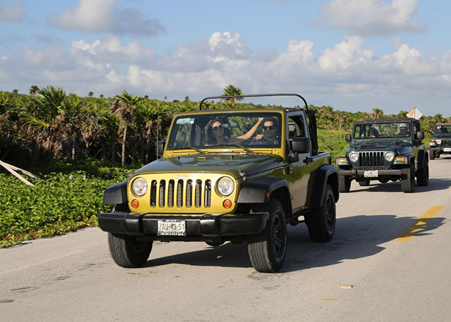 Alan, Martha, and Wanda riding a Jeep in the island of Cozumel.