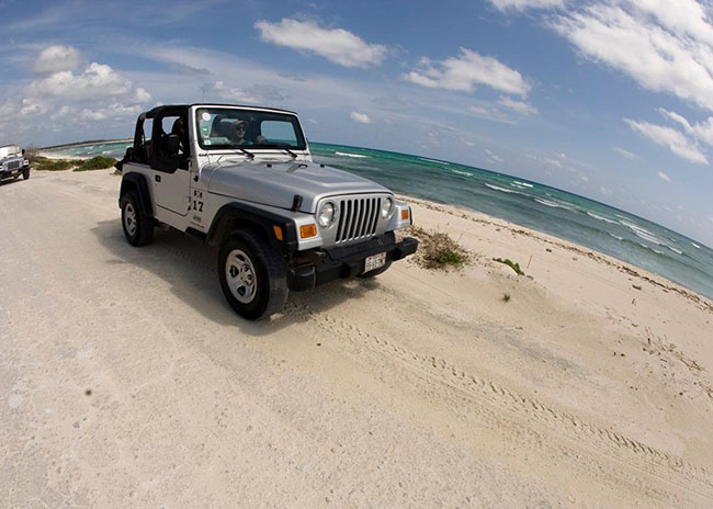 Andrew very happy to ride a Jeep in the island.