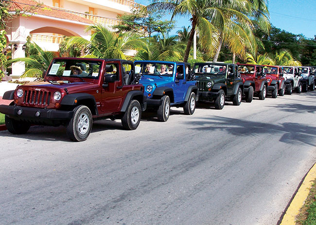 Donald and a group of Jeeps about to start an excursion to see Cozumel.
