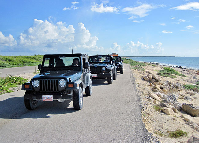 Richard in a Jeep tour with friends, family, and the excursion guides.